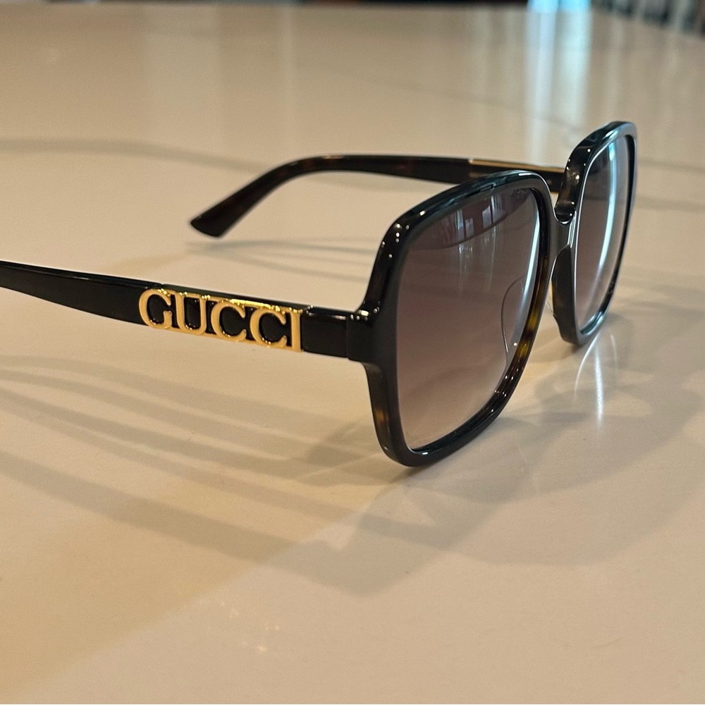 Gucci Black and Gold Sunglasses